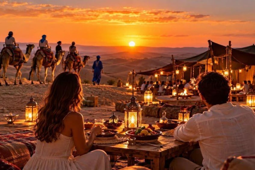 A desert sunset with people on camels and tents. 1
