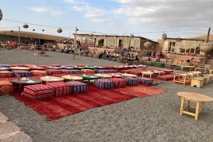 A market with colorful rugs and tables. 5