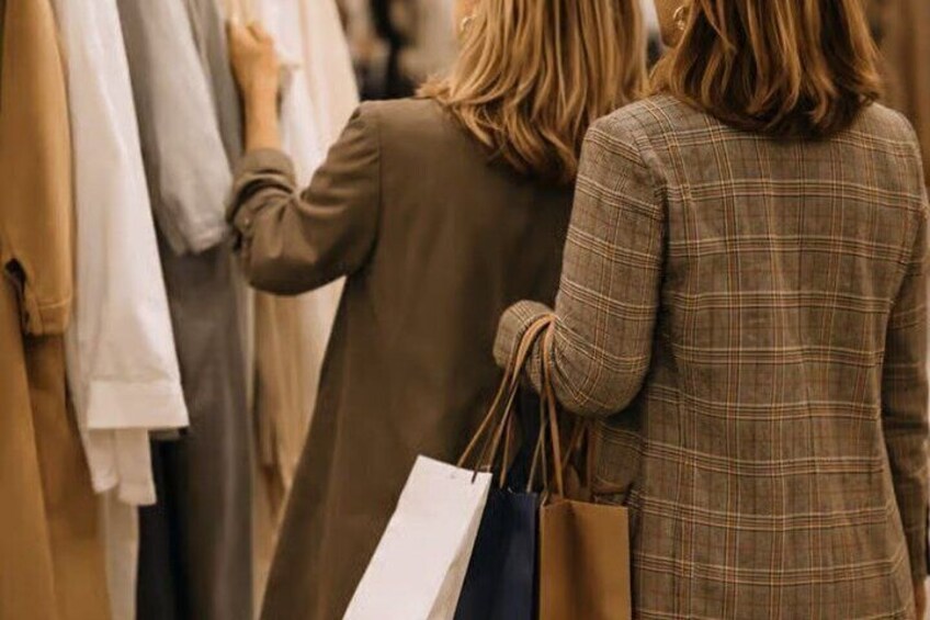 Two people shopping in a clothing store. 5