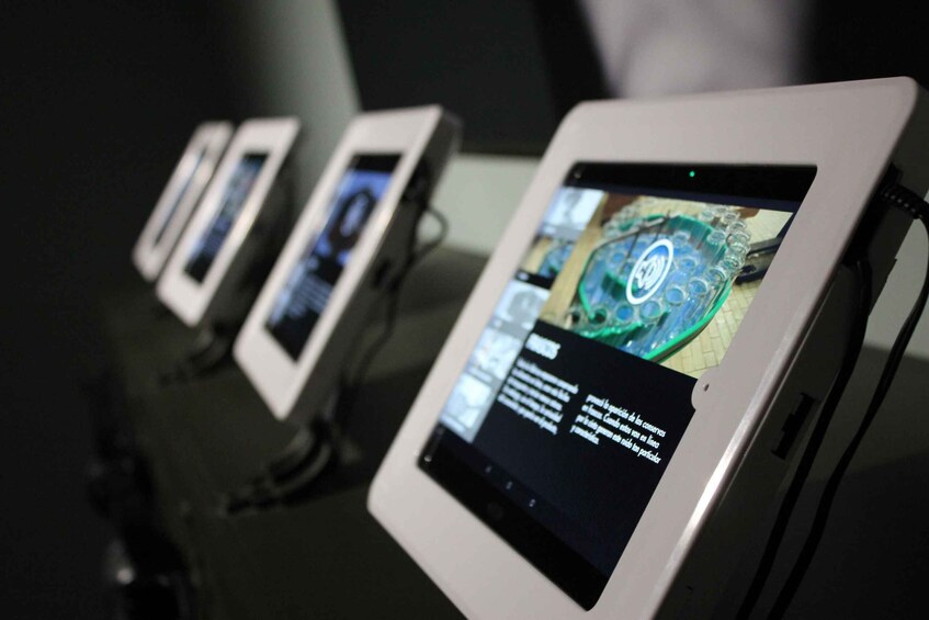 A row of tablets displaying various content. 2