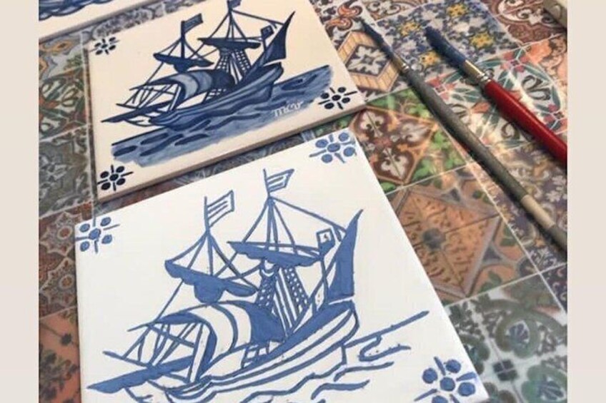 Two blue and white tiles with ship designs. 4