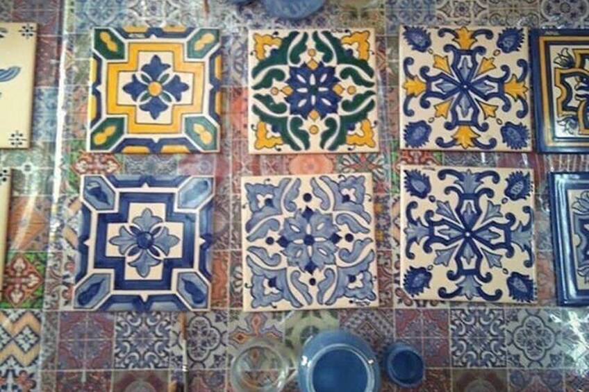 A variety of colorful ceramic tiles with intricate patterns. 5