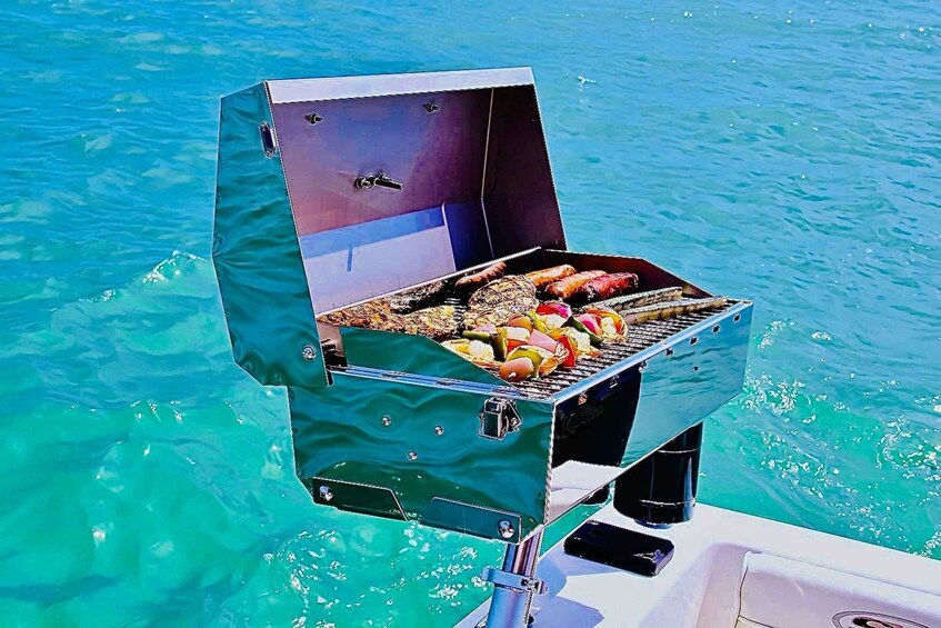 A portable grill with food on it, floating on a body of water. 2