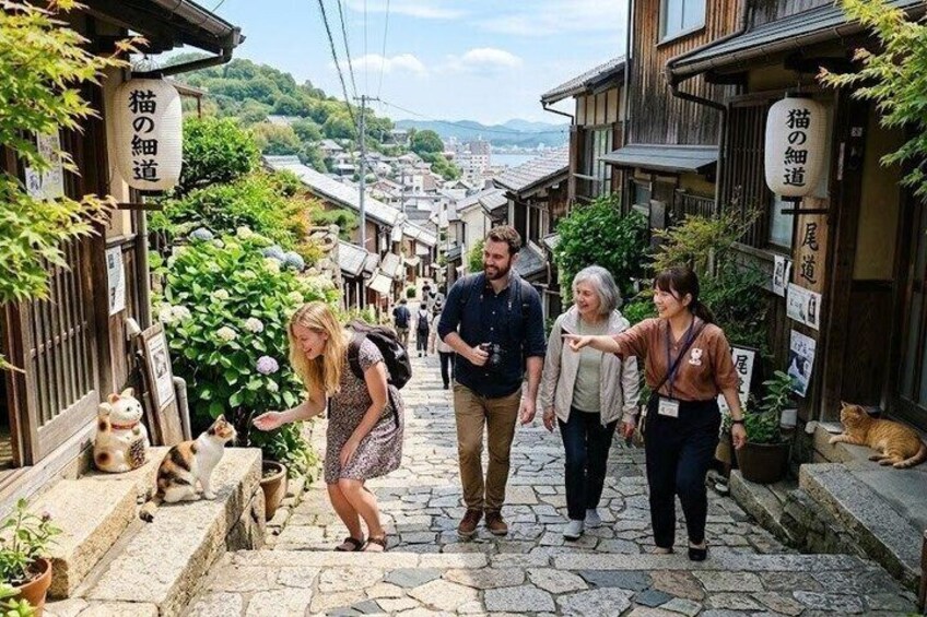 A narrow street with stone steps, traditional wooden buildings, and signs in Japanese. 1