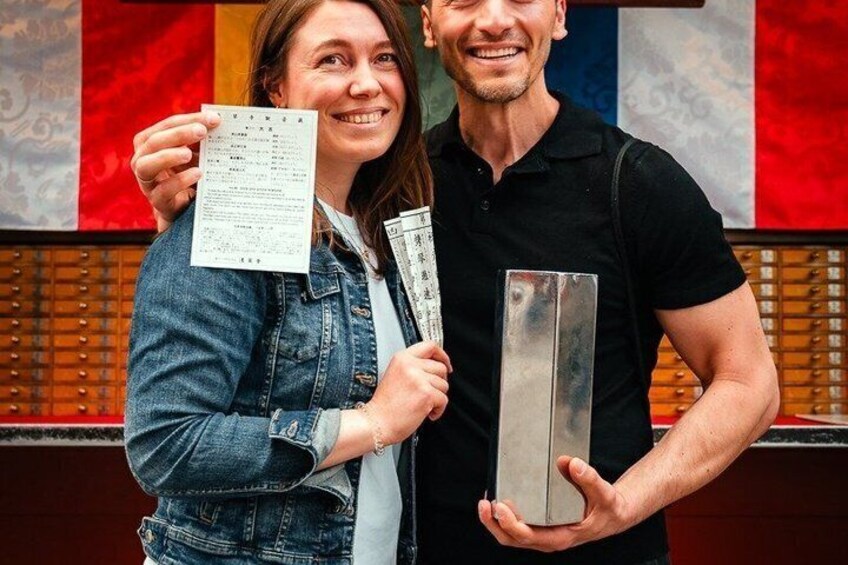Two people holding a menu and a rectangular object. 4
