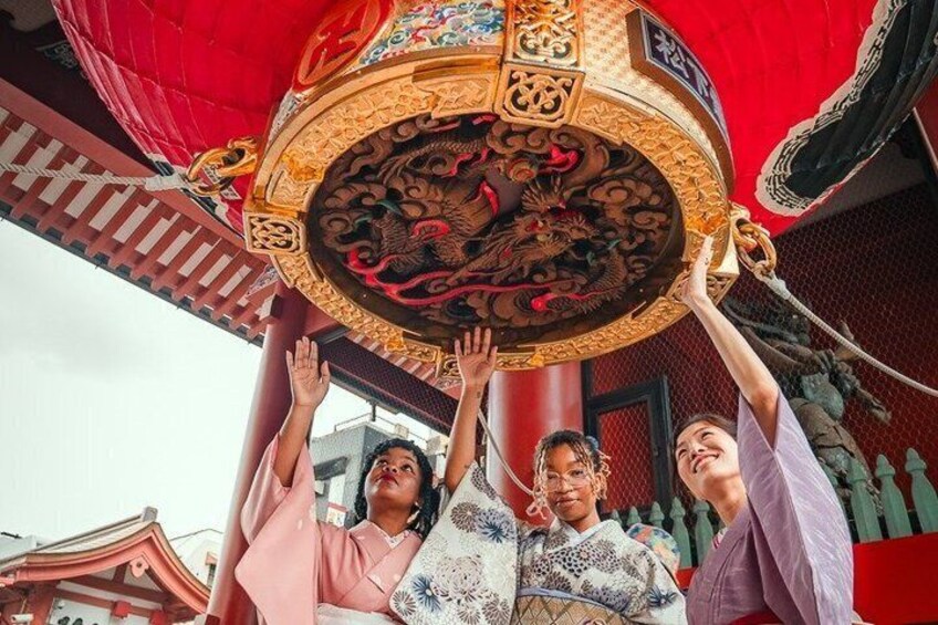 A traditional Chinese architectural structure with ornate decorations and a red lantern. 2