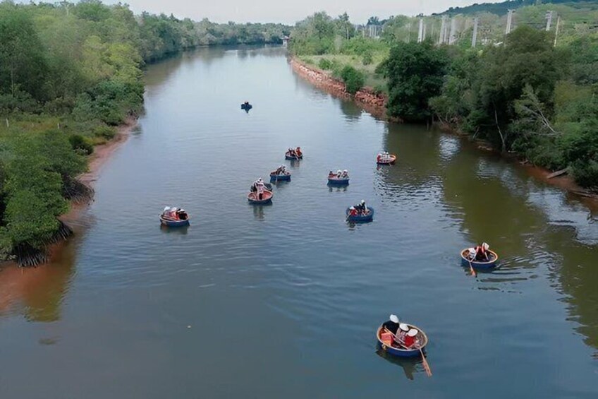 A river with several small boats floating on it. 2