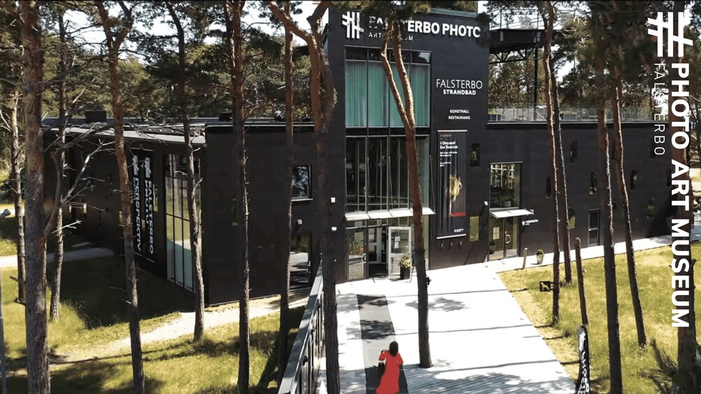 A modern building with a sign for Falsterbo Strandbad and a restaurant. 4
