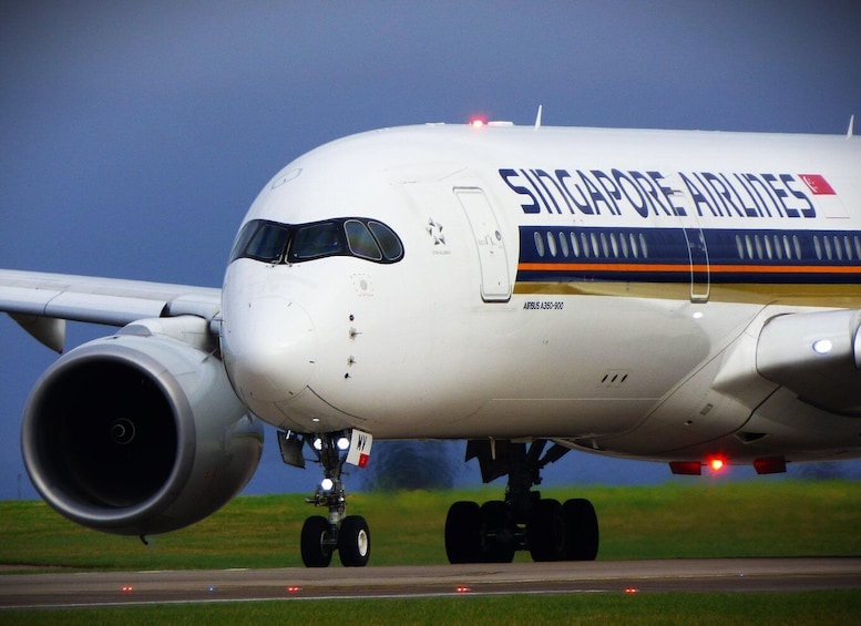 A Singapore Airlines Airbus A350-900 on the ground with its landing gear extended. 1