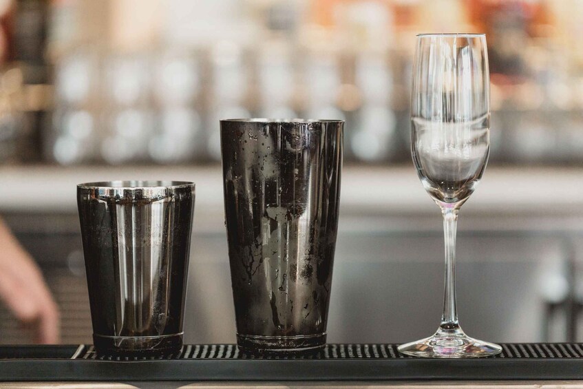 Three glasses on a bar counter. 1