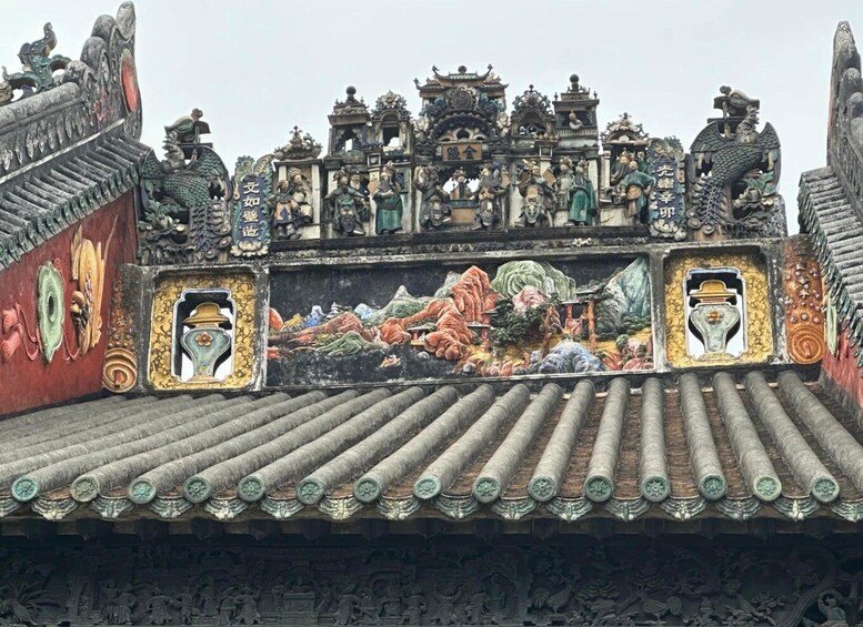 A traditional Chinese roof with ornate decorations and sculptures. 4