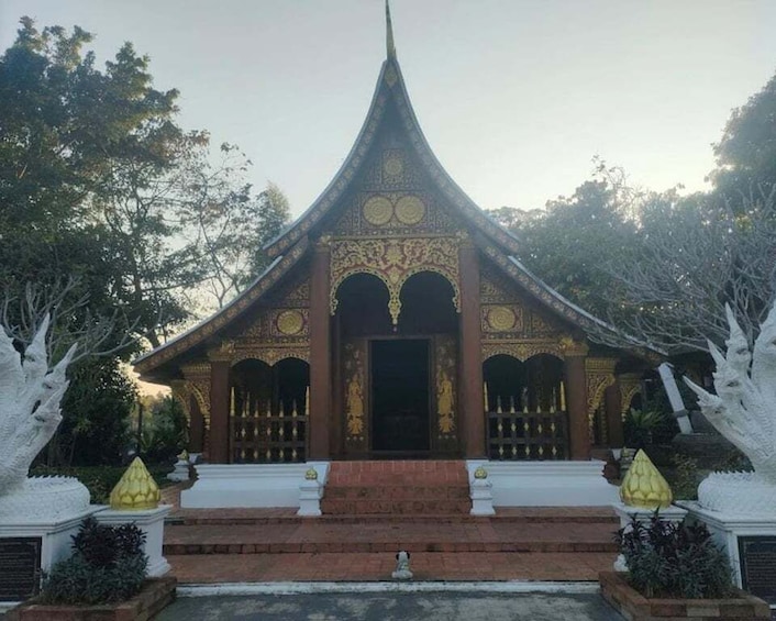 A traditional temple with ornate architecture, a pointed roof, and a central entrance. 3