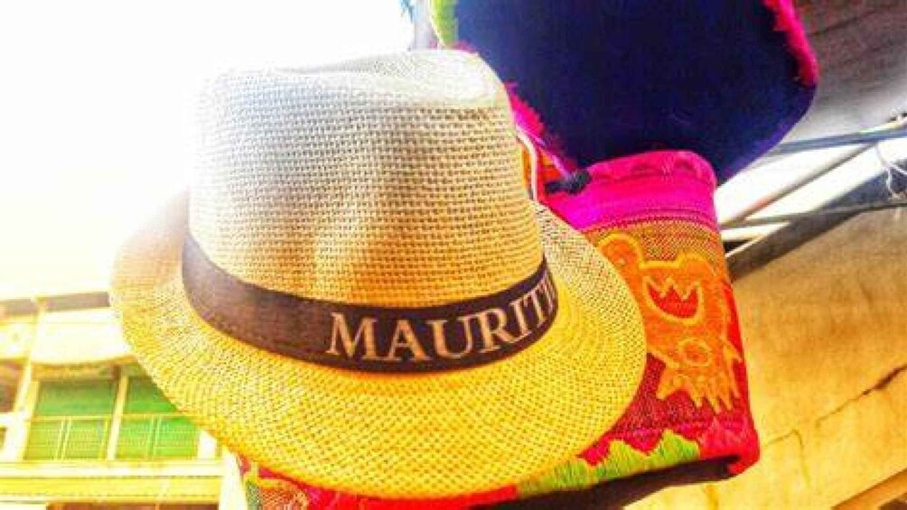 A straw hat with 'MAURITIUS' written on it. 5