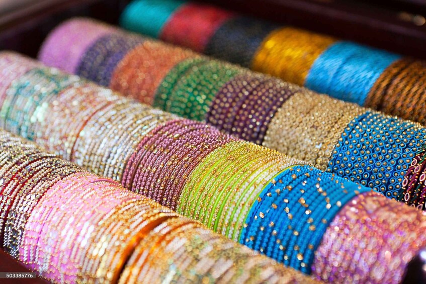 A collection of colorful, beaded bangles. 4