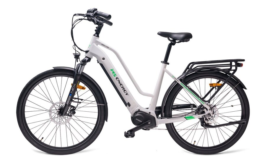 A white electric bicycle with a black seat, a rear rack, and disc brakes. 3