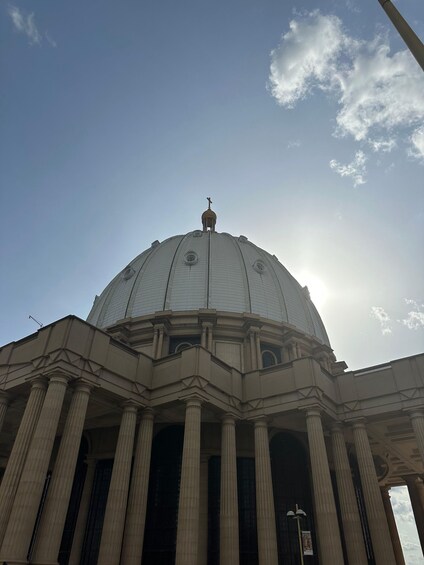 A large building with a dome and columns. 3