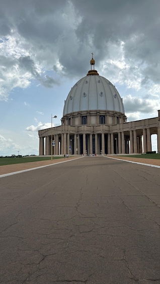 A large, domed building with a cross on top, surrounded by a wide open plaza. 1