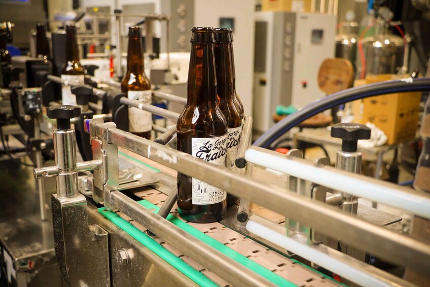 Bottles on a conveyor belt in a brewery. 5
