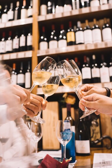 A person holding a wine glass. 2