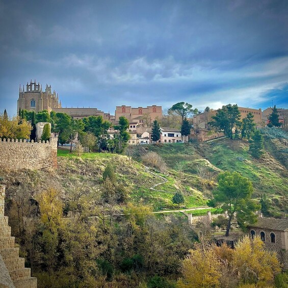 A historic hilltop city with a prominent cathedral and fortified walls. 5