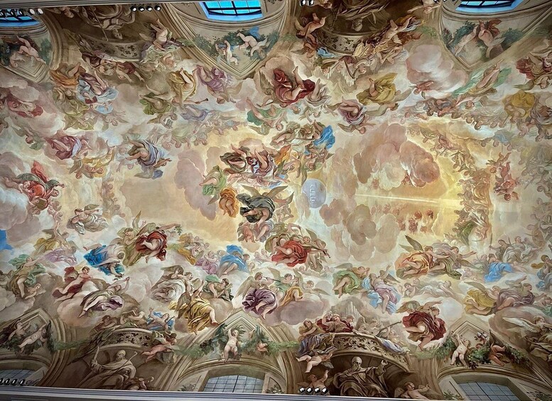 A detailed fresco ceiling with classical figures and architectural elements. 1