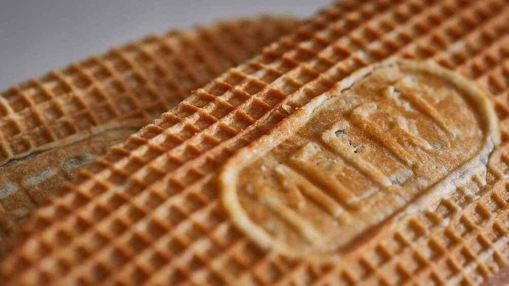 A close-up of a waffle with a waffle iron imprint. 5
