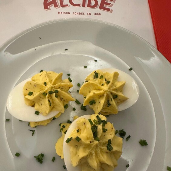 A plate with three egg halves garnished with chives. 4