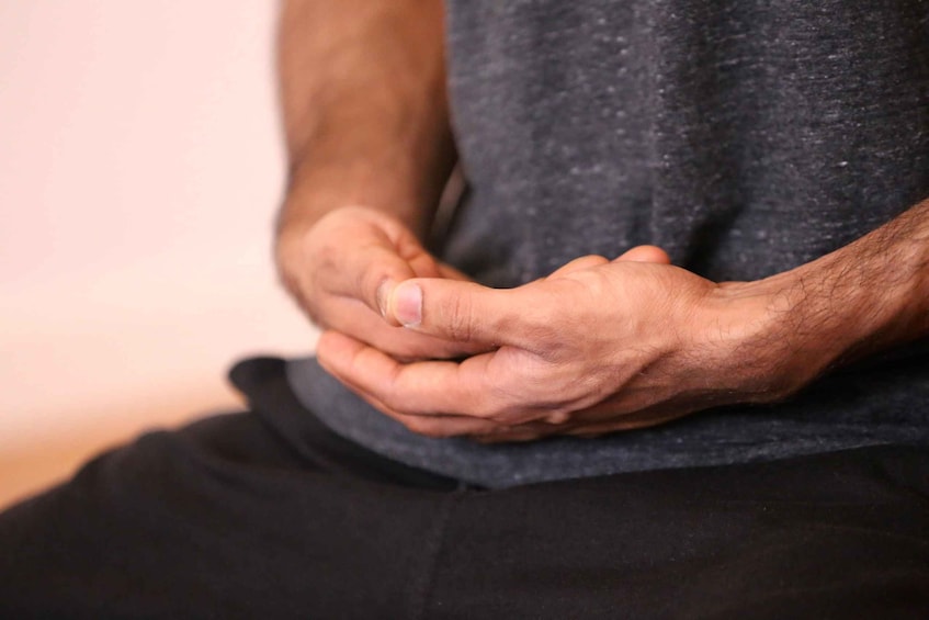 A person's hands clasped together. 5