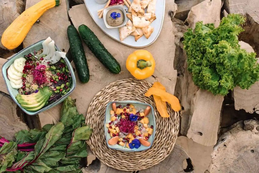 A variety of fresh vegetables and salads on a stone surface. 3