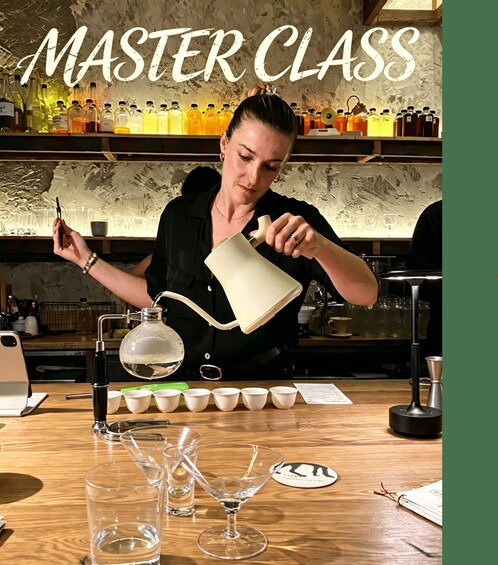 A bartender pouring a drink into a glass. 1