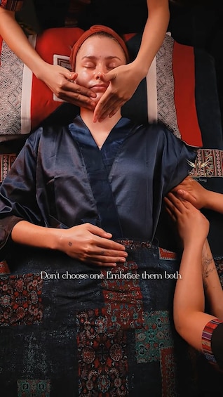 A person receiving a massage with hands on their face and neck. 5