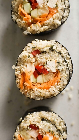 Sushi rolls with rice, cucumber, and carrot. 2