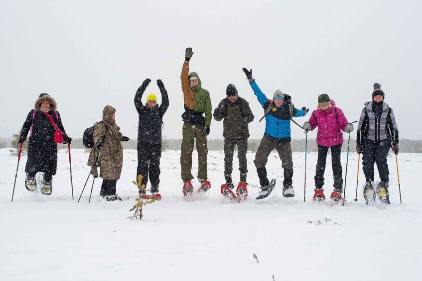 A group of people skiing on a snowy slope. 5
