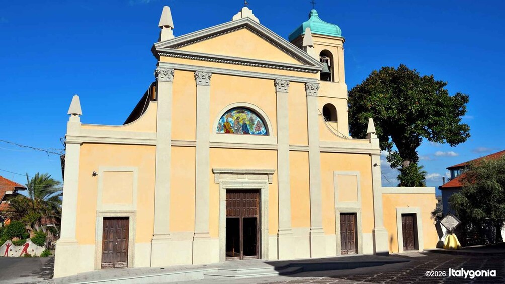 A church with a bell tower and a large arched window. 2