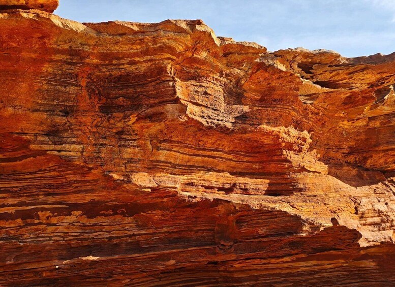 Layered red rock formations with visible stratification. 2