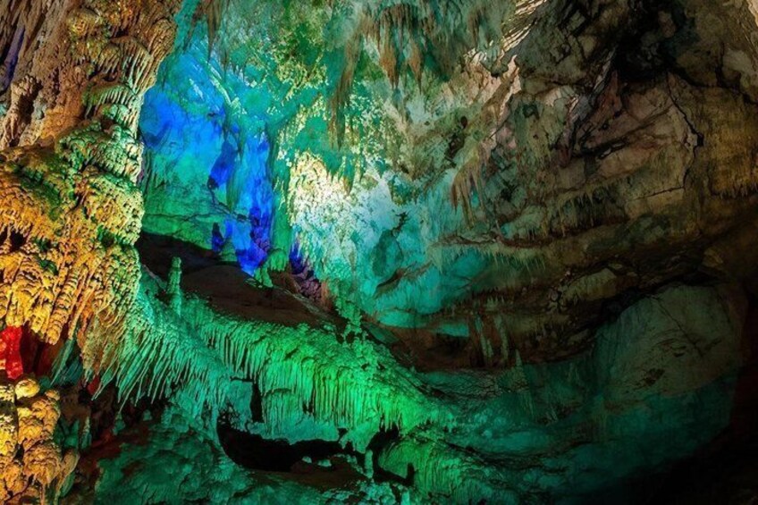 A cave with colorful stalactites and stalagmites. 3