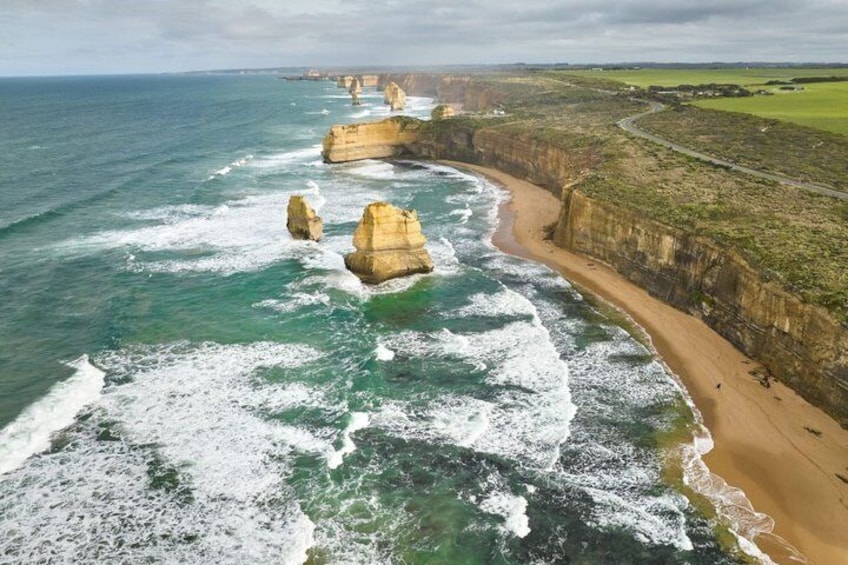 A coastal landscape with cliffs and waves. 1