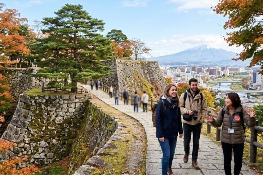 A stone pathway with a view of a mountain and cityscape. 1