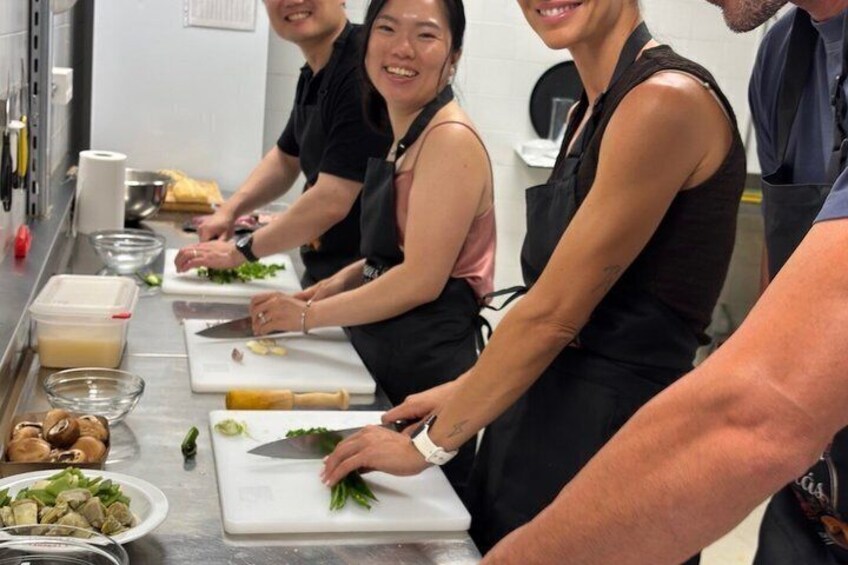 Chefs preparing food in a kitchen. 5