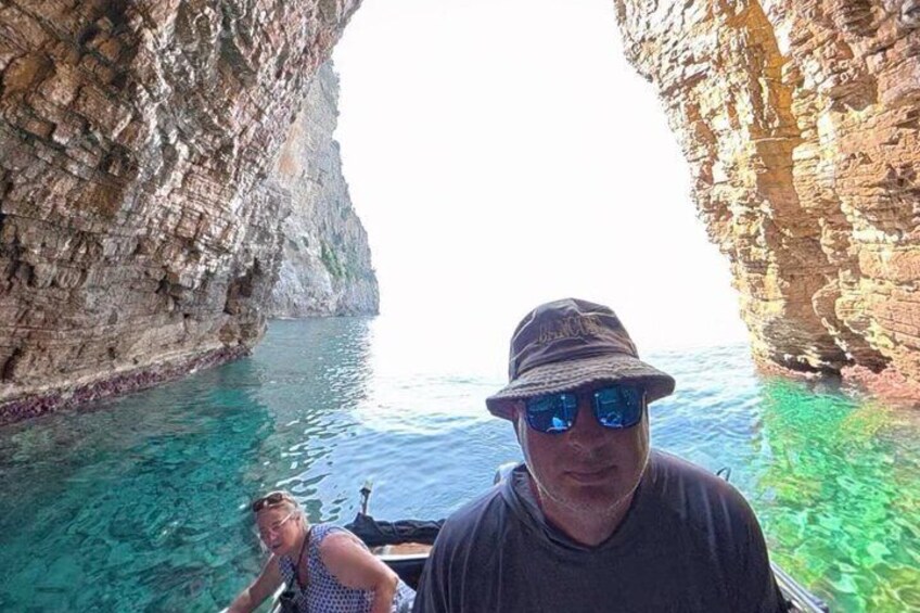 A boat navigating a narrow waterway between rocky cliffs. 3