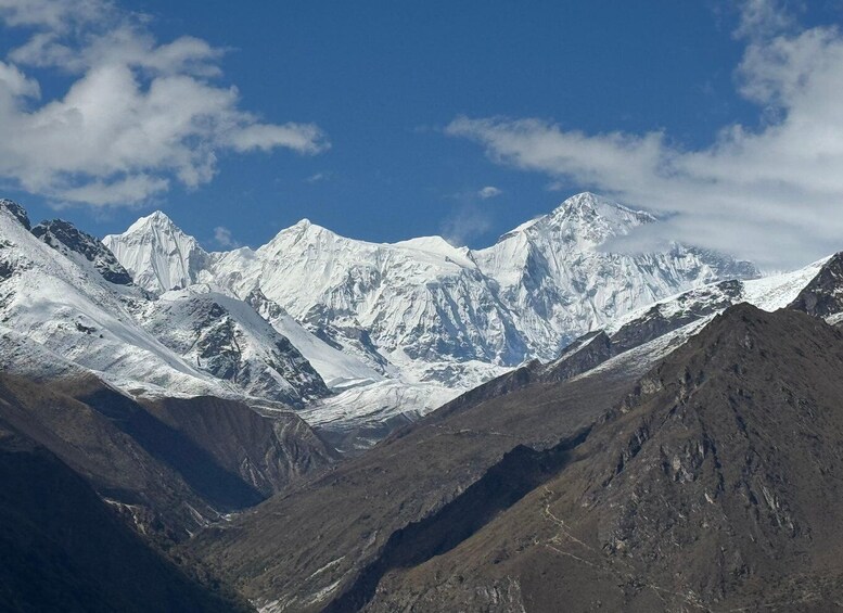 A range of snow-capped mountains under a clear sky. 2