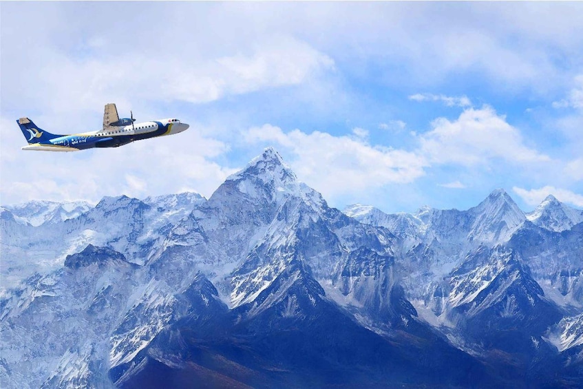 An airplane flying over a mountain range. 5