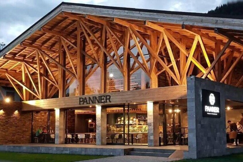 A restaurant named 'PANNER' with a wooden exterior and a large open patio area. 3