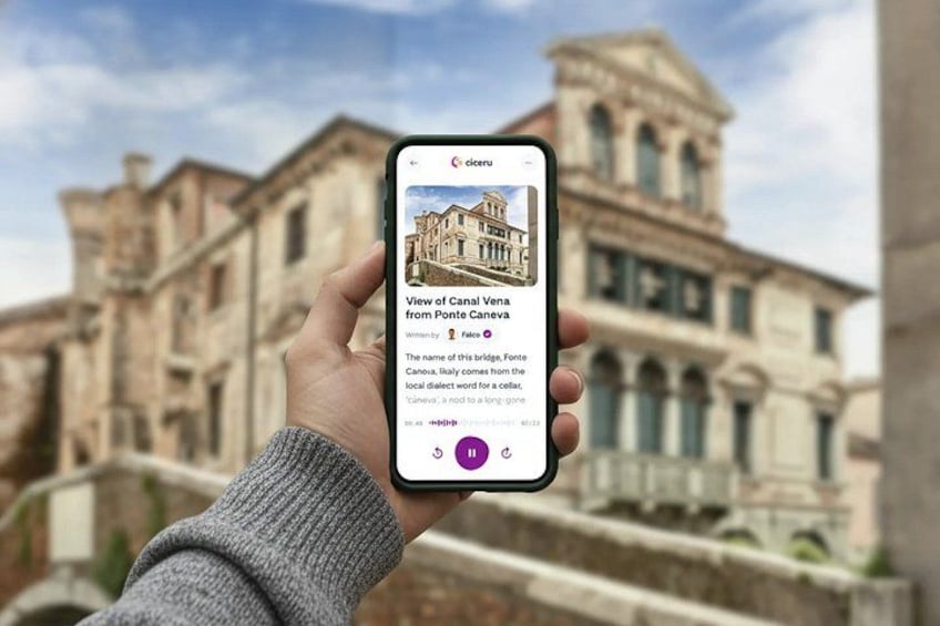A hand holding a smartphone displaying a view of Canal Vena from Ponte Caneva. 1