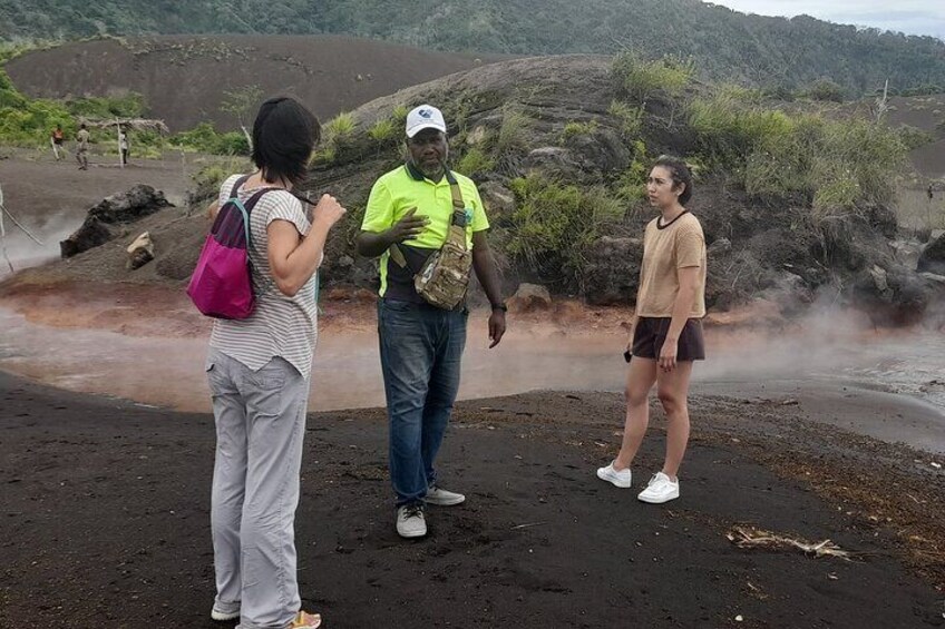 Our tour guide giving a commentary at the volcanic hot springs during a private tour. 5