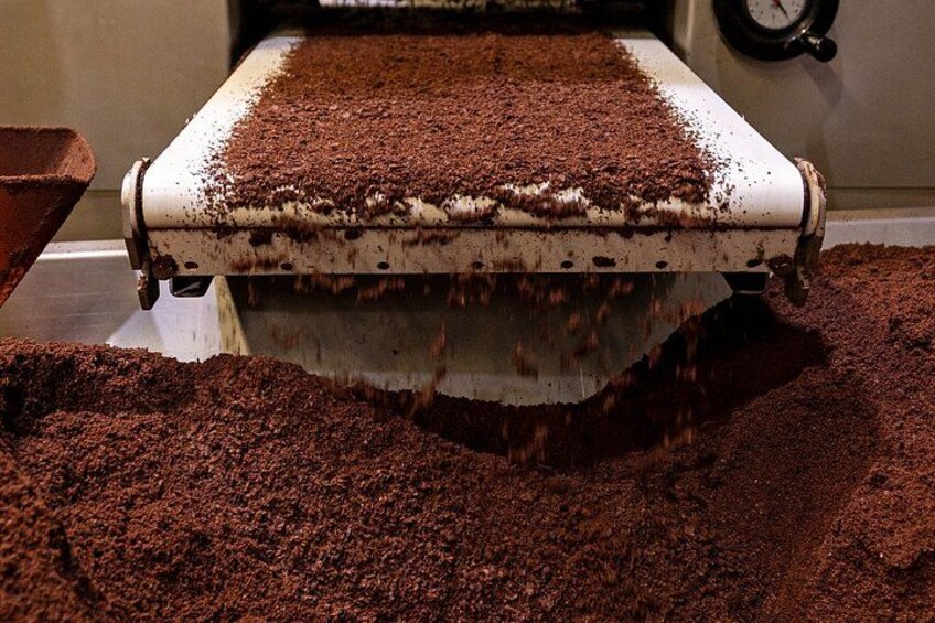 A machine processing cocoa powder. 2