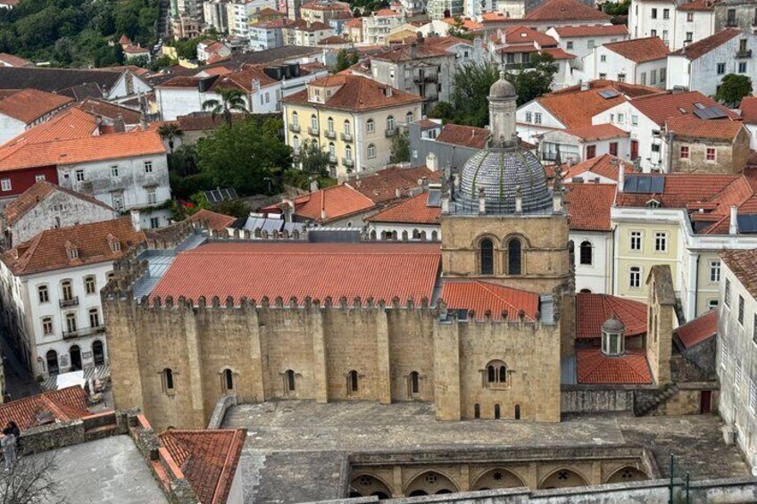 A historic cityscape with a prominent church featuring a dome and a bell tower. 2