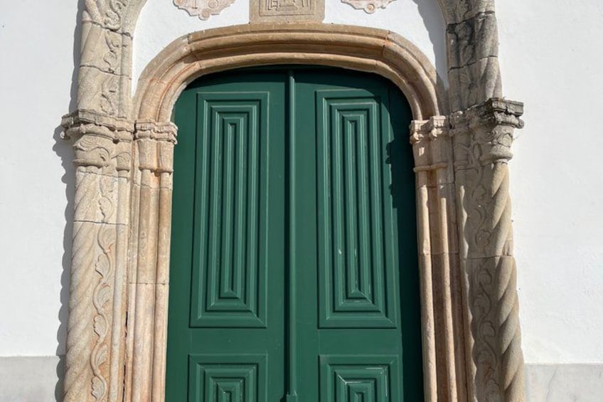 A green door with a stone archway. 3