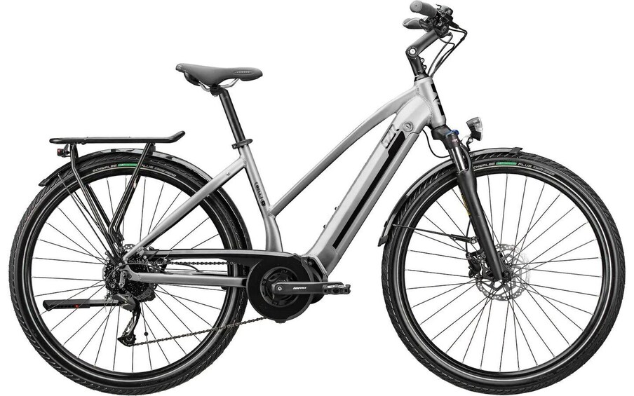 A stationary electric bicycle with a front suspension fork, disc brakes, and a rear rack. 2
