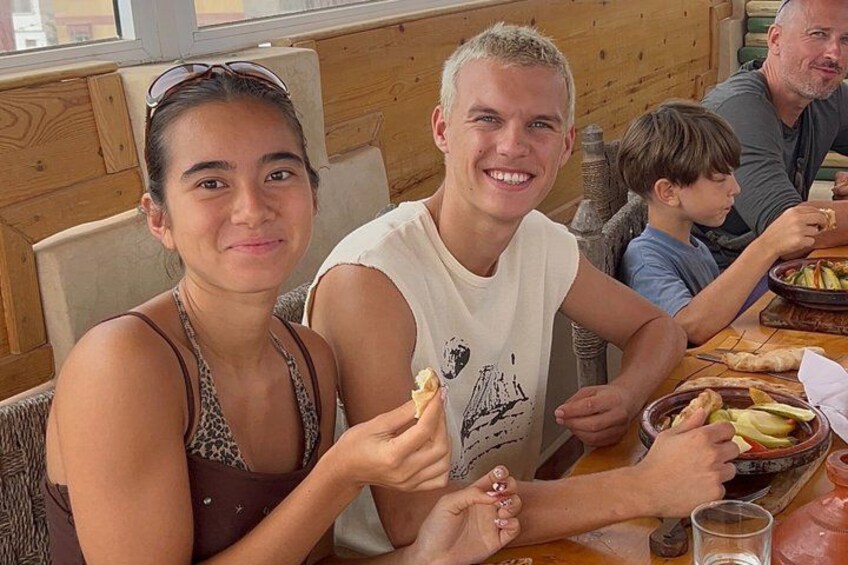 A family dining at a restaurant with a wooden interior. 5
